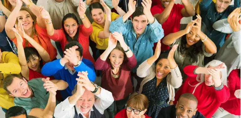A group of people celebrating a change management achievement